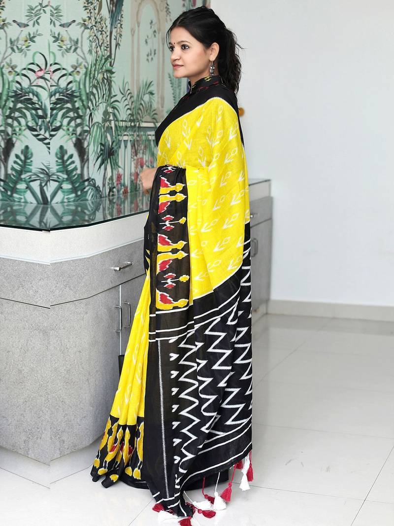 yellow ethnic motifs printed ikat saree
