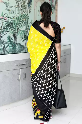 yellow ethnic motifs printed ikat saree