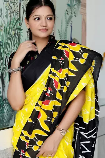 yellow ethnic motifs printed ikat saree