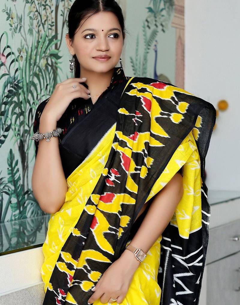 yellow ethnic motifs printed ikat saree