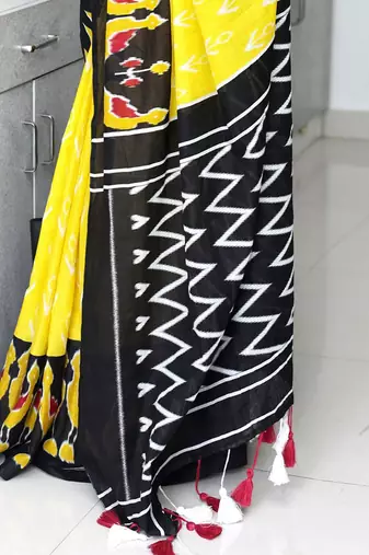 yellow ethnic motifs printed ikat saree