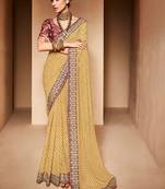 cream embroidered bandhani saree