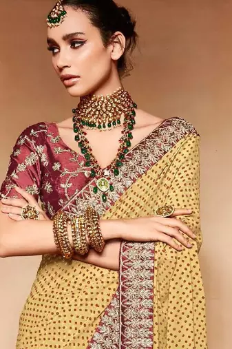 cream embroidered bandhani saree