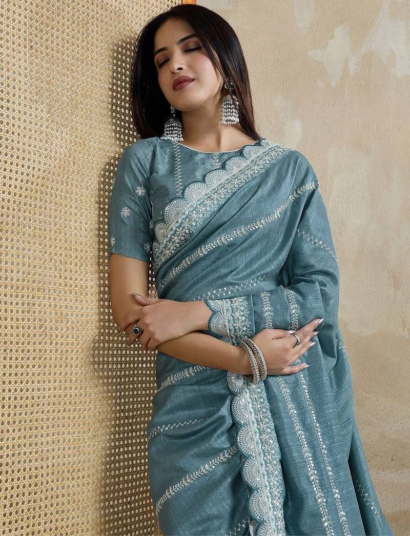 teal ethnic motifs embroidered silk blend saree