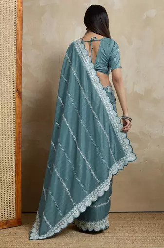 teal ethnic motifs embroidered silk blend saree