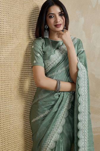 green ethnic motifs embroidered saree