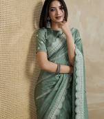 green ethnic motifs embroidered saree