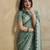 green ethnic motifs embroidered saree