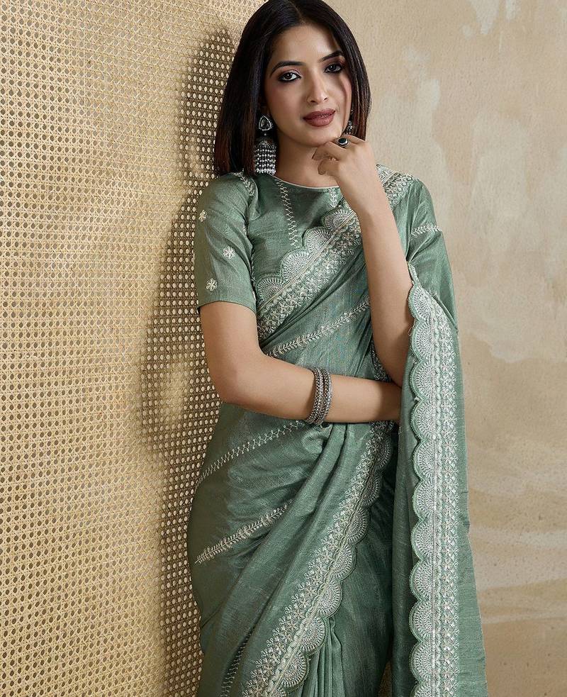 green ethnic motifs embroidered saree