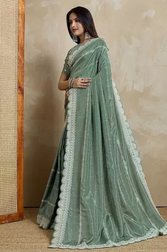 green ethnic motifs embroidered saree