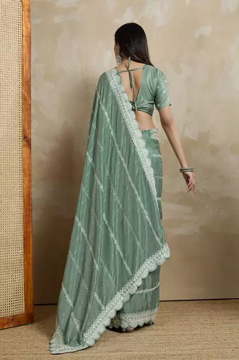 green ethnic motifs embroidered saree