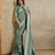 green ethnic motifs embroidered saree