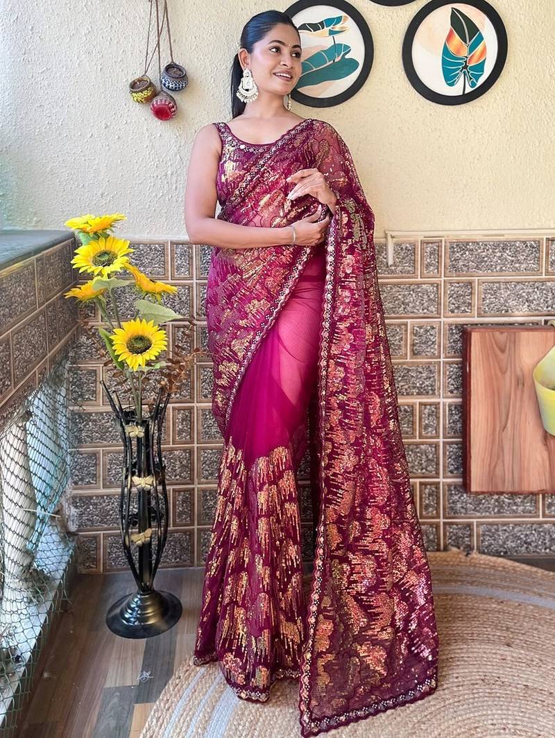 magenta embellished sequinned net saree with blouse piece