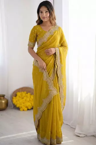 yellow embellished beads and stones poly georgette heavy work saree