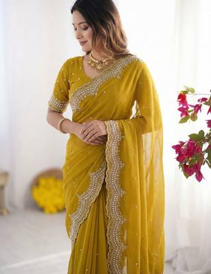 yellow embellished beads and stones poly georgette heavy work saree 5