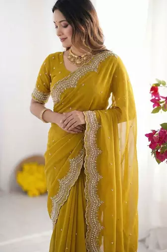 yellow embellished beads and stones poly georgette heavy work saree