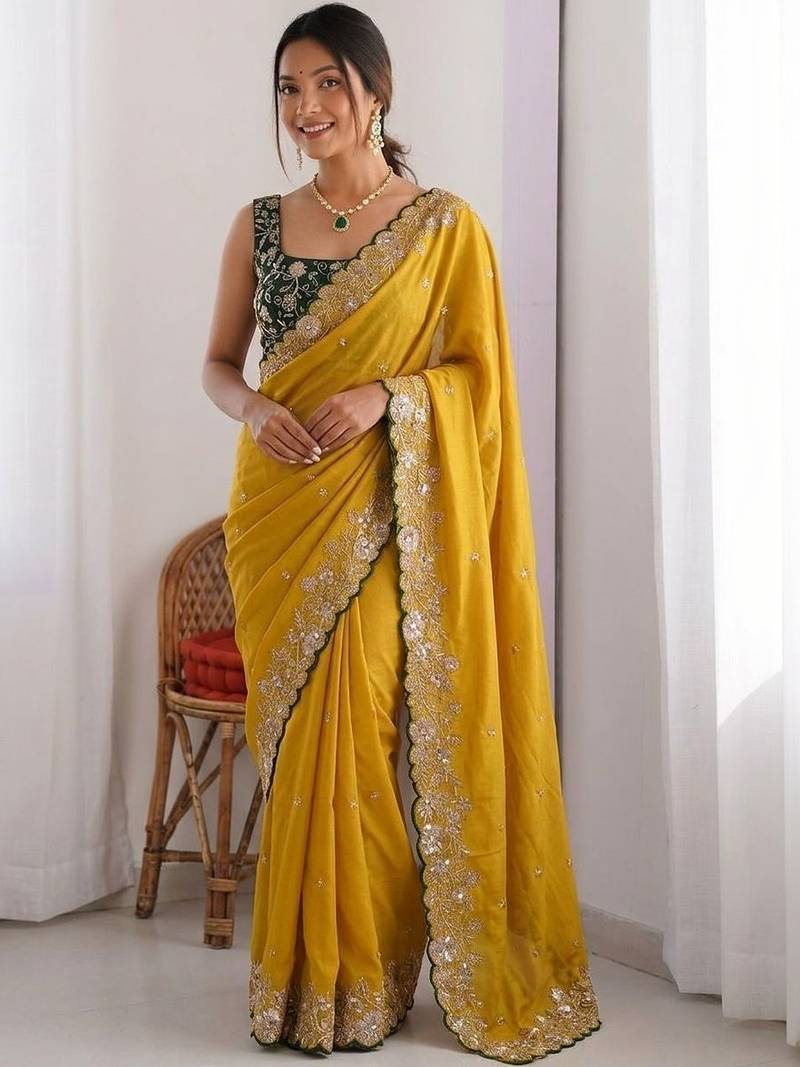 Yellow embellished embroidered pure georgette heavy work saree