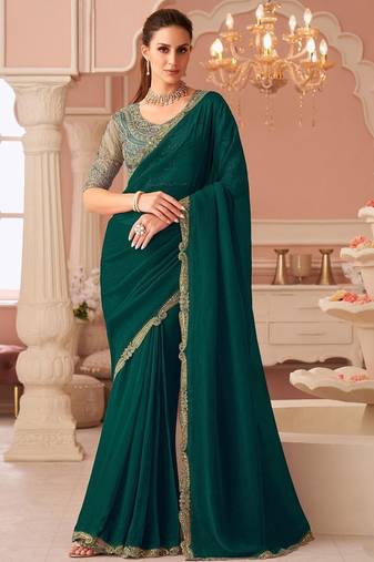 Green sequinned pure georgette saree