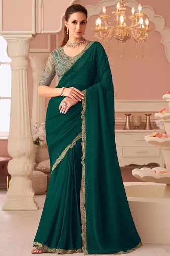 Green sequinned pure georgette saree