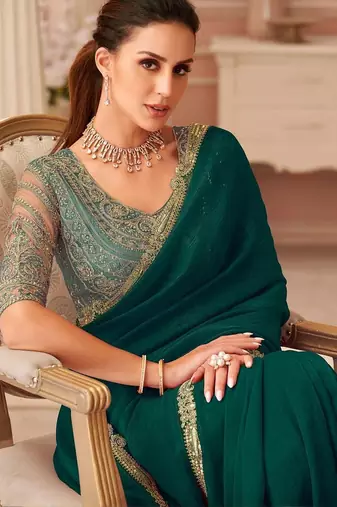Green sequinned pure georgette saree