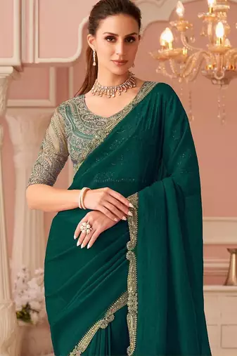Green sequinned pure georgette saree