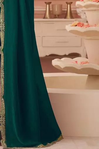 Green sequinned pure georgette saree