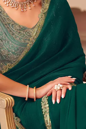 Green sequinned pure georgette saree