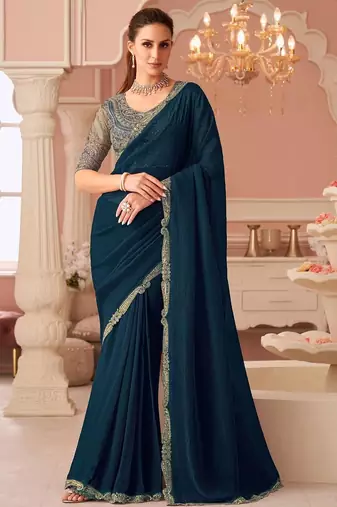 Teal sequinned pure georgette saree