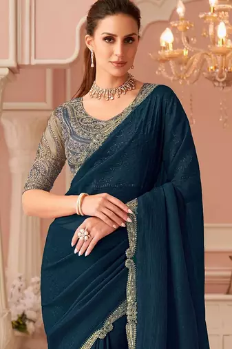 Teal sequinned pure georgette saree