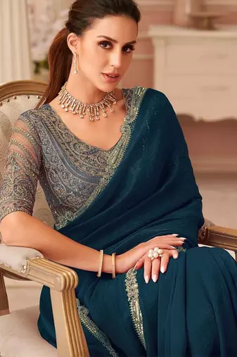 Teal sequinned pure georgette saree