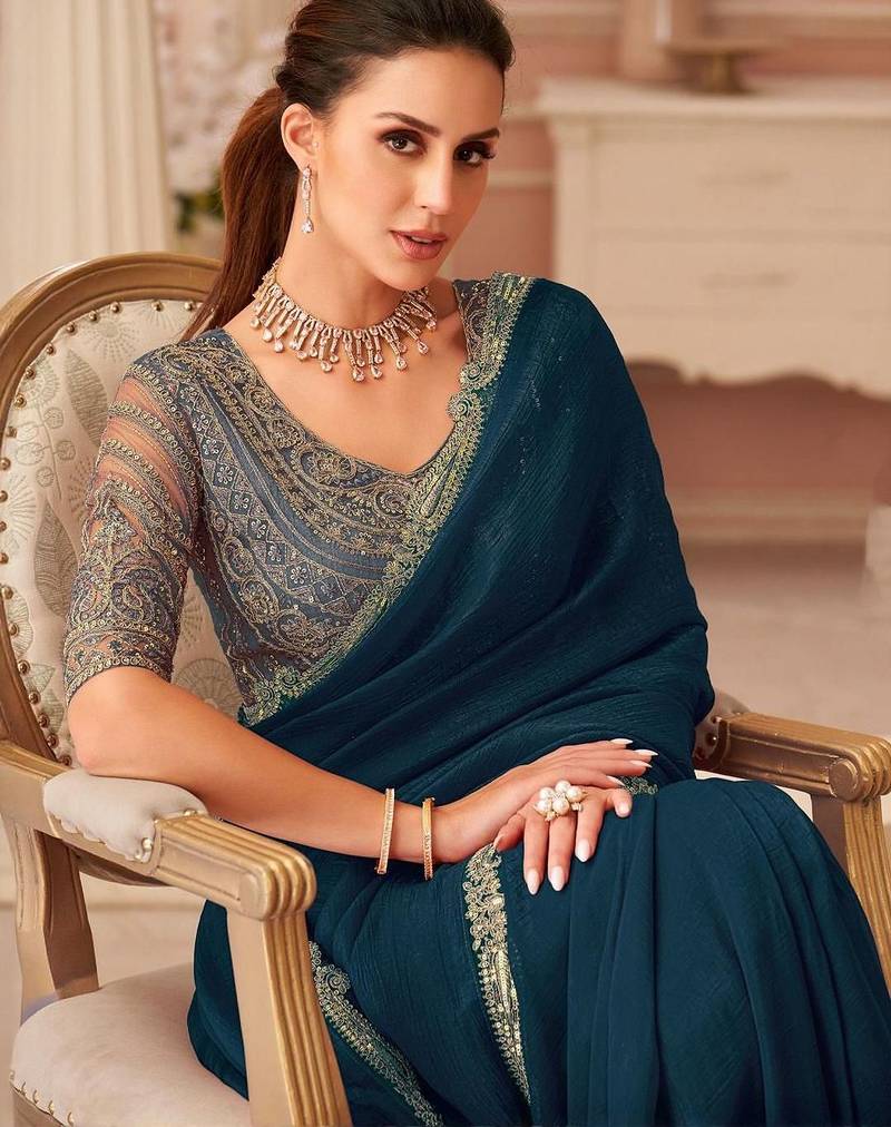 Teal sequinned pure georgette saree