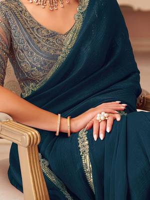 Teal sequinned pure georgette saree 5
