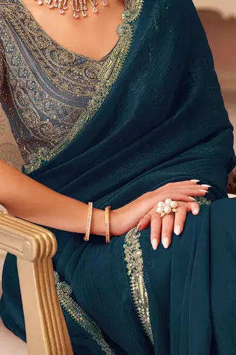 Teal sequinned pure georgette saree
