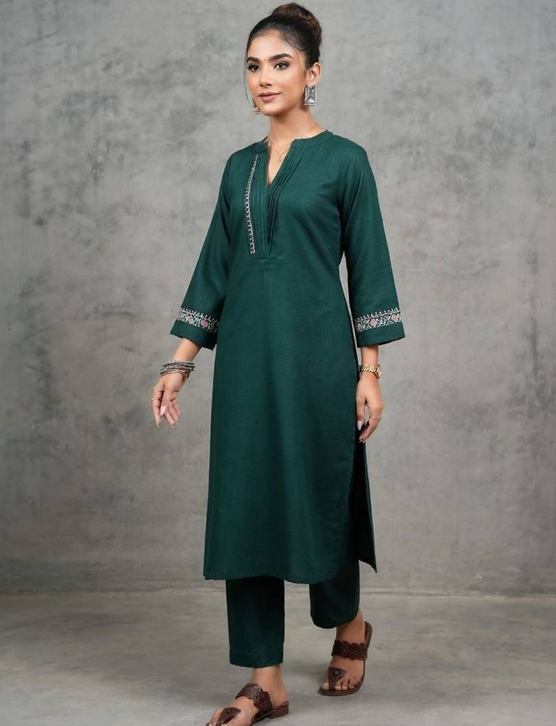 classic women embroidered regular thread work kurta with trousers