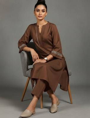 women embroidered sleek thread work work kurta with trousers 1