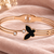 Rose gold butterfly bangle bracelet with black enamel & crystal