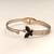 Rose gold butterfly bangle bracelet with black enamel & crystal
