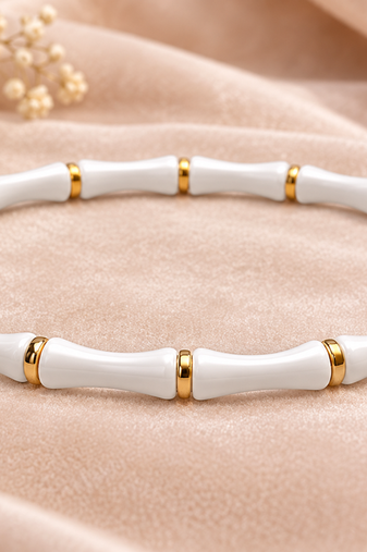 White & gold bamboo-style bracelet with magnetic clasp