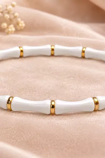White & gold bamboo-style bracelet with magnetic clasp