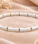 White & gold bamboo-style bracelet with magnetic clasp