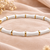 White & gold bamboo-style bracelet with magnetic clasp