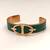 Green leather cuff bracelet with gold-tone anchor motif
