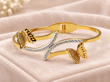 Gold-tone butterfly bangle bracelet with crystal embellishments 1