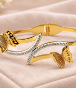 Gold-tone butterfly bangle bracelet with crystal embellishments