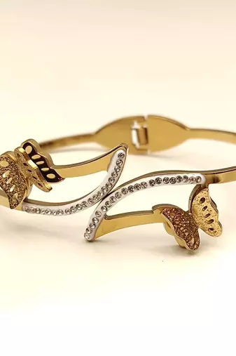 Gold-tone butterfly bangle bracelet with crystal embellishments