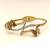 Gold-tone butterfly bangle bracelet with crystal embellishments