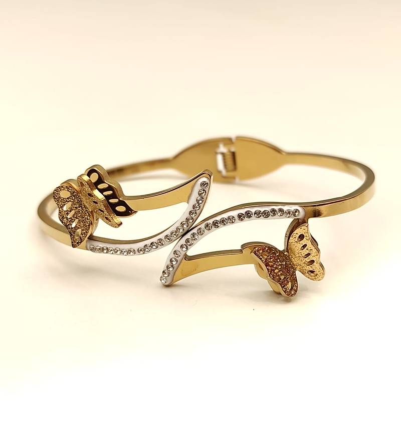 Gold-tone butterfly bangle bracelet with crystal embellishments