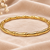 Gold-toned bamboo design bangle bracelet for women