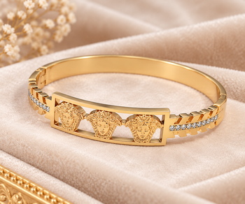 Gold-tone medusa bangle bracelet with crystal accents 1