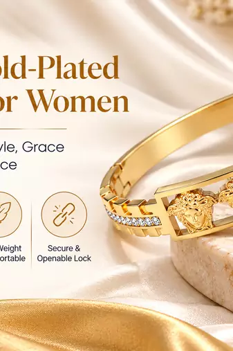 Gold-tone medusa bangle bracelet with crystal accents